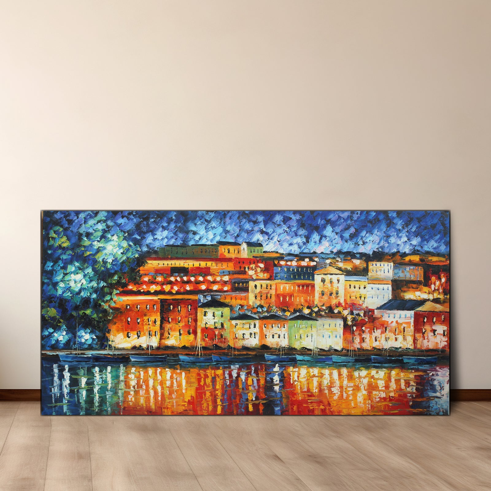 An oil painting on canvas depicting a colorful cityscape at night with reflecting lights on water, gallery wrap with wood frame.