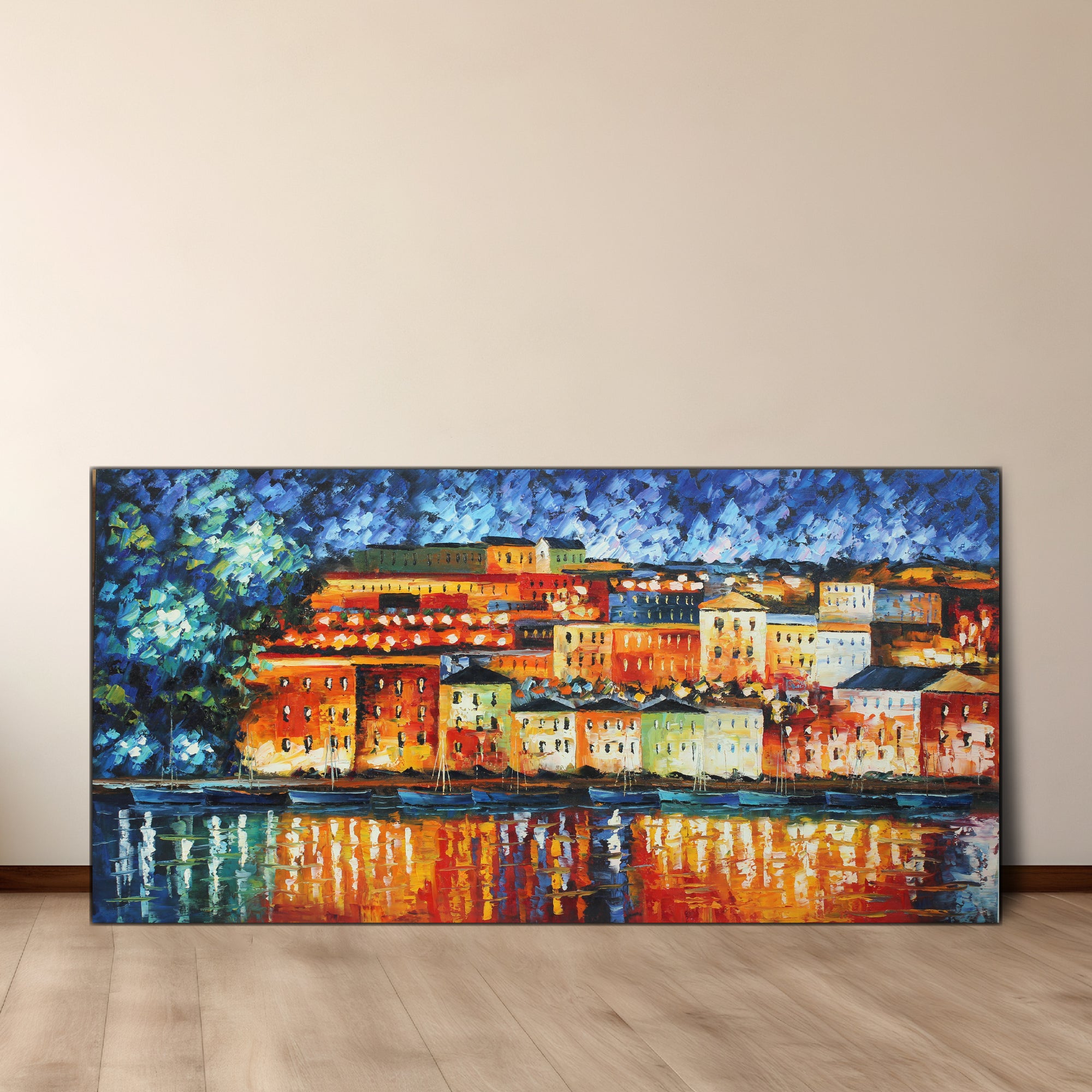 An oil painting on canvas depicting a colorful cityscape at night with reflecting lights on water, gallery wrap with wood frame.