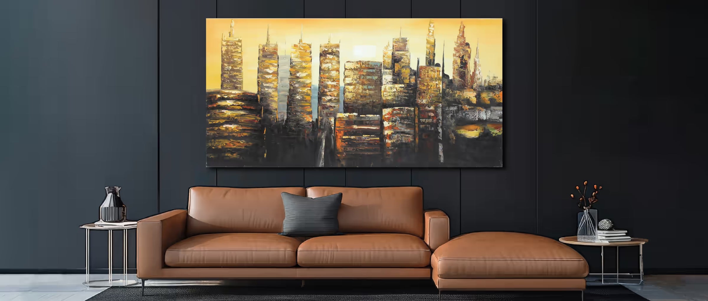 Brown leather sofa with decorative pillows in a living room setting, featuring a large abstract painting of cityscapes on the wall.